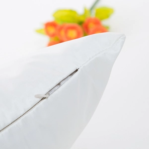 White silk satin cushion cover featuring dandelion print and invisible zipper detail