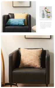 Detail view of chenille pillow cover with minimalist white geometric line patterns