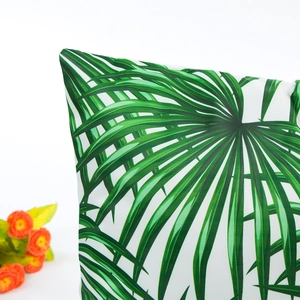 Satin pillowcase featuring green palm leaf print on white background for home decor