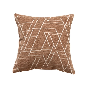 Terracotta chenille throw pillow cover with white geometric lines on a plain background