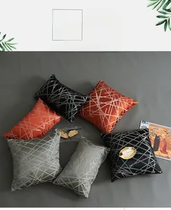 Close-up of geometric metallic jacquard stripes on luxury satin cushion covers
