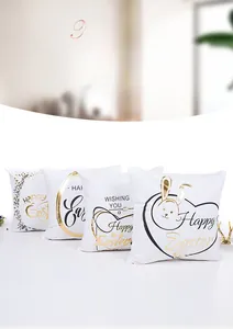 Detailed view of the gold foil Easter patterns on white fabric pillowcases
