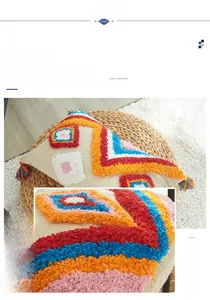 Detailed view of colorful geometric tufting and handmade tassels on bohemian pillow cover