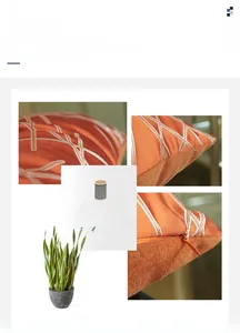 Detail of orange striped pillowcase showing high precision embroidery and hidden zipper
