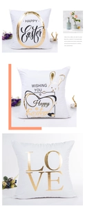 Detailed view of white Easter pillow covers with gold foil bunny and LOVE patterns