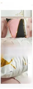 Detail of pink geometric pillowcase showing invisible zipper and gold foil stripe texture