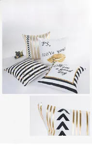 Detail of modern striped pillow covers with gold foil patterns and hidden zipper closure