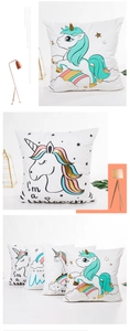 Detailed close-up of cartoon unicorn pillowcase with gold foil prints and rainbow patterns