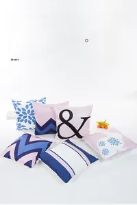 Detailed view of satin pillowcases with geometric patterns and silk luster finish