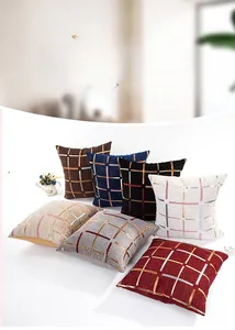 Close-up of gold gilded plaid patterns on colorful chenille decorative cushion covers