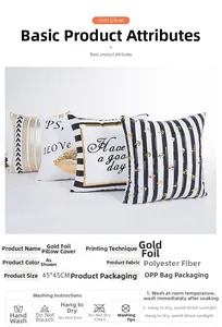 Close-up of modern gold foil pillow covers with stripes and text patterns in polyester