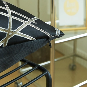 Modern black geometric throw pillow cover with gold embroidery and invisible zipper
