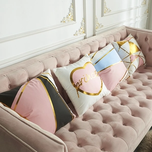 Pink and gold foil decorative pillow covers featuring geometric patterns and princess text