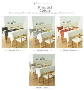 Mosaic jacquard table runner with tassels shown in black, grey, orange and camel colors