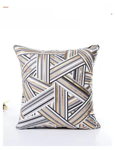 Detail of modern geometric stripe pillowcase with gold foil stamping on textured fabric