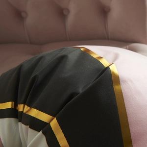 Pink and black pillowcase with gold foil stripes in a modern luxury home setting
