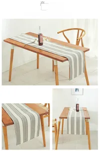 Detailed texture of gray and white striped linen table runner in a cozy dining setting