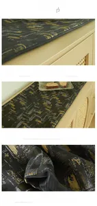 Close-up of woven geometric mosaic pattern and metallic gold textures on grey table runner