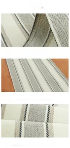 Detailed macro view of herringbone weave texture on a striped cotton linen table runner