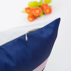 Navy and pink geometric satin pillowcase featuring a premium invisible zipper detail