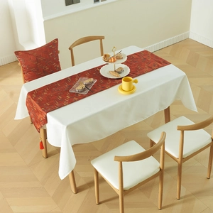 Modern geometric mosaic table runner with red-brown jacquard texture and tassels