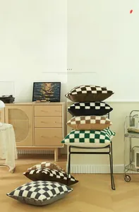 Close-up of checkerboard lamb wool pillow covers with soft tufted texture in various colors