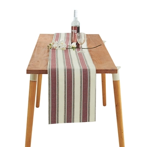 Linen cotton table runner with red and grey vertical stripes and herringbone weave