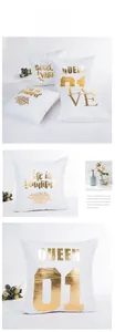 Detail of white velvet pillowcase featuring gold foil Love lettering and botanical prints