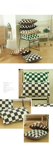 Close-up of fluffy checkerboard lamb wool pillow covers in various warm color tones