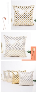 Close-up of gold foil geometric diamond pattern on white decorative cushion covers