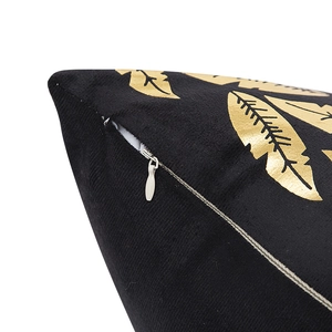Black velvet cushion cover with gold foil leaves and invisible zipper detail