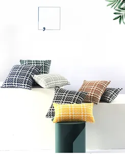 Detail of woven textured pillowcase fabric in navy, yellow, and grey tones