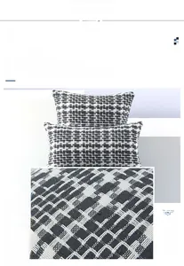 Close-up of black and white woven pillow cover showing high-quality tweed texture