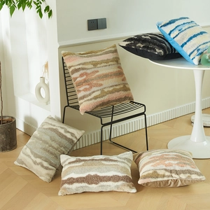 Assorted decorative plush throw pillow covers with abstract wave textures and tufted fabric