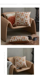 Detail of geometric chain pattern embroidery on luxury orange and brown pillow covers