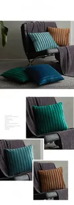 Detail of pleated velvet cushion covers in dark green, blue and brown on a leather chair