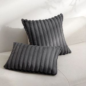 Thick plush dark grey striped pillows displayed in square and lumbar set on sofa