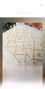Macro view of woven yellow geometric patterns on cream cotton canvas pillow cover