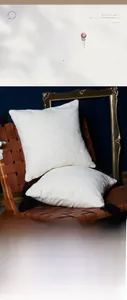 Detail of white jacquard cotton pillowcase with diamond texture and black tassels