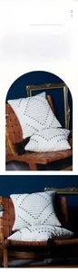 Detailed macro view of white cotton canvas cushion cover with black geometric tassels