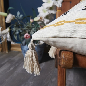 Bohemian cotton pillow cover with yellow geometric embroidery and tassel fringe details