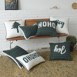 Christmas green plaid pillows with festive embroidery and cozy fleece edging decor