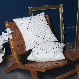 Bohemian cream cotton canvas pillow cover with black geometric embroidery and tassels