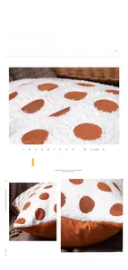 Detail of white chenille pillowcase featuring orange polka dots and hidden zipper closure
