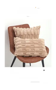 Close-up of fluffy faux rabbit fur pillow cover with vertical 3D grain and tufted texture