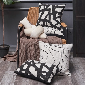 Nordic style chenille pillow covers with geometric patterns and white knotted cushion