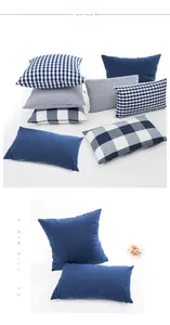 Detail of denim blue cotton-polyester pillowcase with plaid patterns and hidden zipper