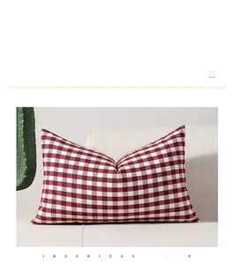 Macro detail of red and white gingham pillowcase with fine textured woven fabric