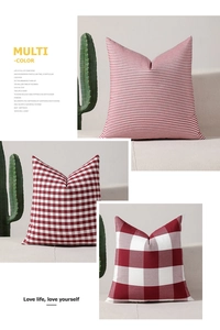 Detail of red and white buffalo plaid and striped patterns on linen throw pillow covers