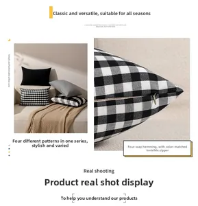 Detail of hidden zipper and overlock stitching on black and white checkered cushion cover